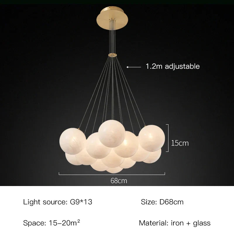 Lustr Celeste Orbs s mléčnými koulemi a zlatým kroužkem na kabelu