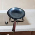 ForgeMaster – Traditional hand-forged cast iron wok with wooden handle