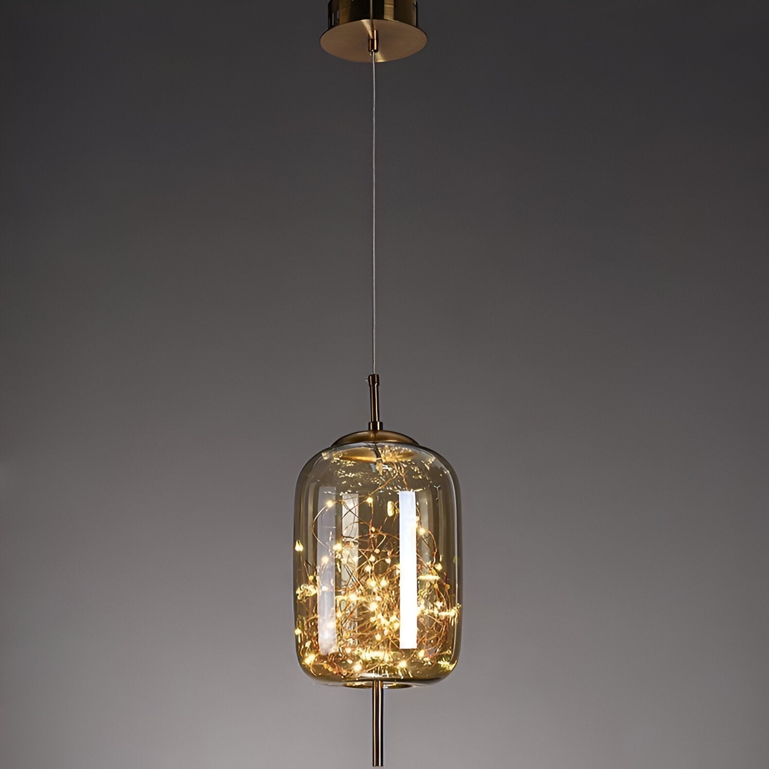 Lampada a sospensione a globo in vetro nordico FjordAura per sala da pranzo con struttura dorata
